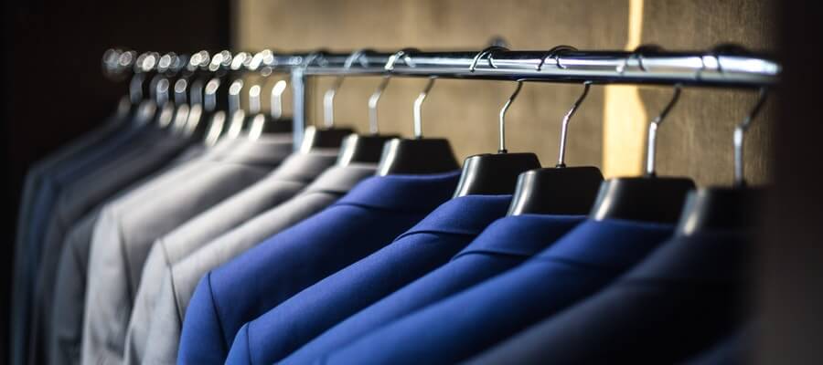 Wardrobe with dark, grey and blue man suits